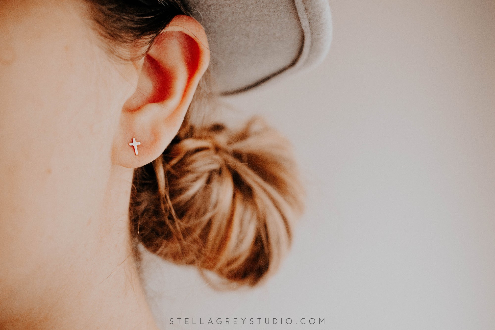 tiny gold cross earrings by good wknd