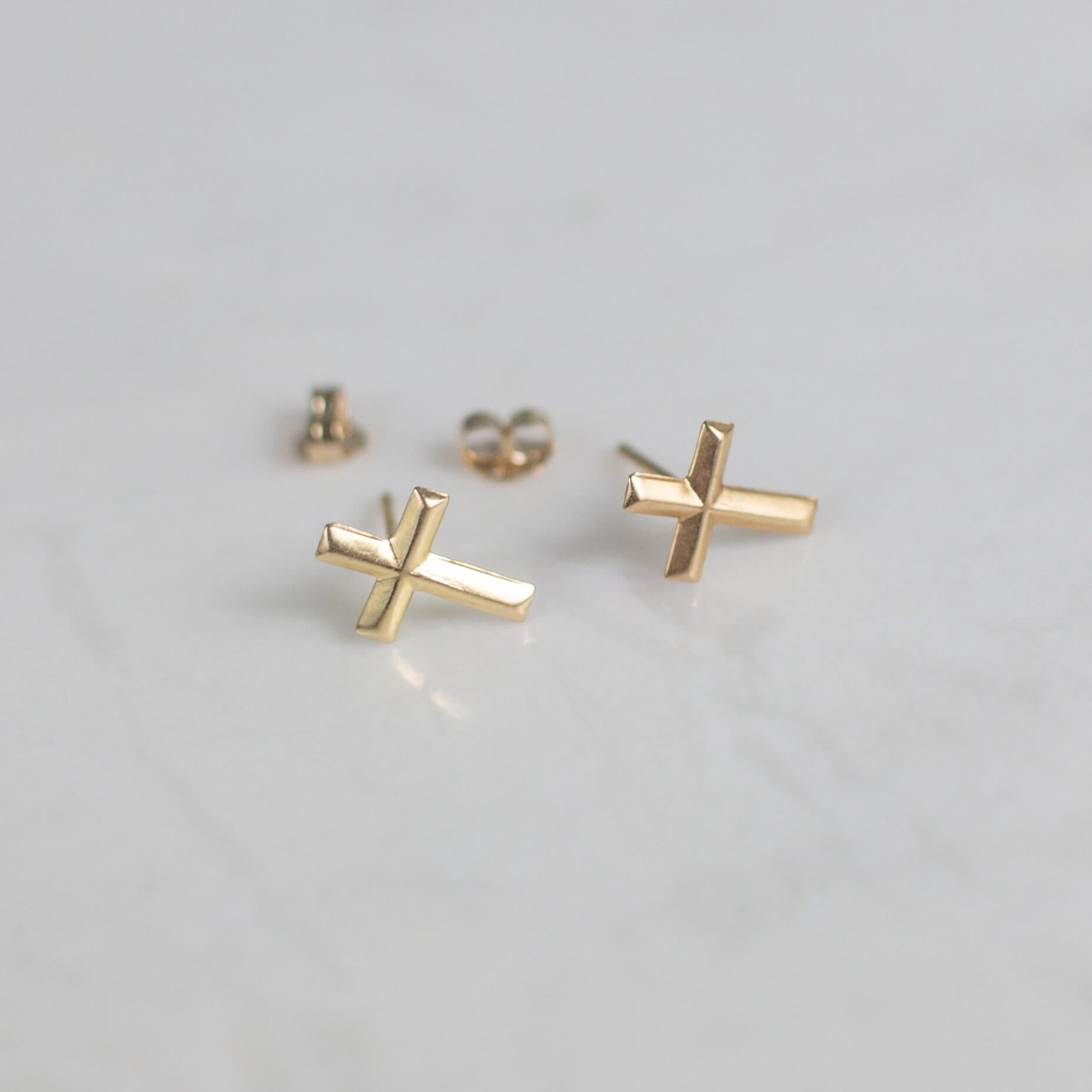 solid gold cross earrings by good wknd